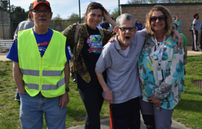Linda Miller (center) with Flicker residents and staff during a Bancroft pep rally