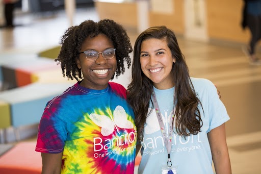 Two Bancroft employees smiling wearing bright colored shirts.